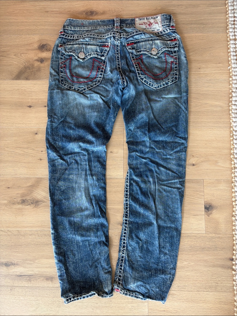 Men’s True Religion jeans with red and white stitching